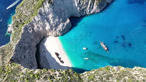 Aerial drone view of Navagio beach on Zakynthos island, Greece. Shipwreck on the beach in Zakynthos island, Greece. Shipwreck Beach or Agios Georgios. is exposed cove in the Ionian Islands of Greece. photo