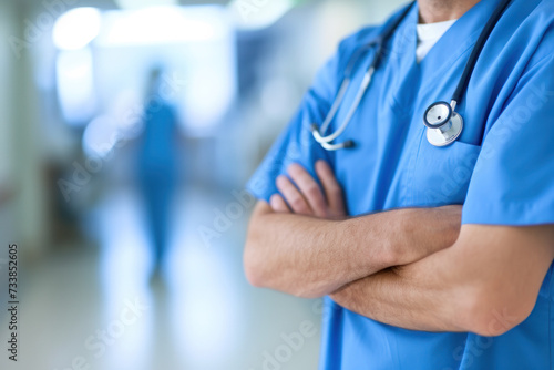 Confident Medical Worker in Scrubs and Stethoscope Standing in Hospital Hallway