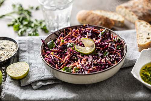 Healthy salad of red cabbage, carrots, coriander and sesame. Healthy eating, vegan food concept