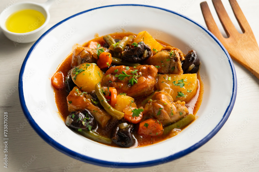 Stewed rabbit with potatoes, green beans, carrots and tomato. Stewed rabbit with potatoes, green beans, carrots and tomato.