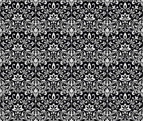 Floral pattern. Vintage wallpaper in the Baroque style. Seamless vector background. White and black ornament for fabric  wallpaper  packaging. Ornate Damask flower ornament