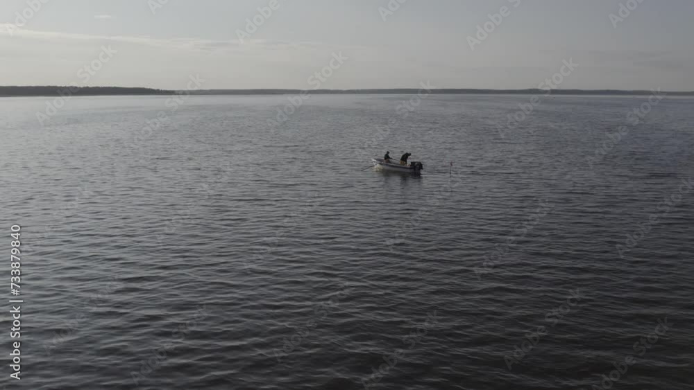 Fishermans boat on lake in sunset Fishermans boat on lake in sunset