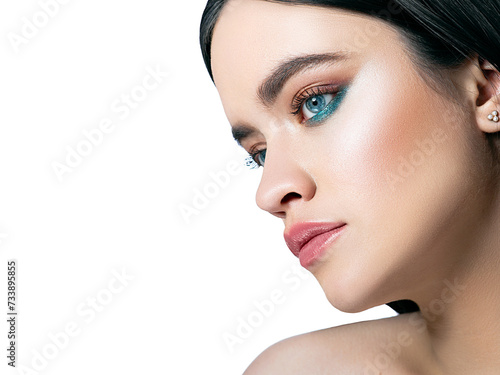 Makeup for blue eyes of a beautiful brunette woman. Trendy individual makeup