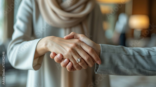 Close-up of business arabian women people shaking hands in modern office. Teamwork concept