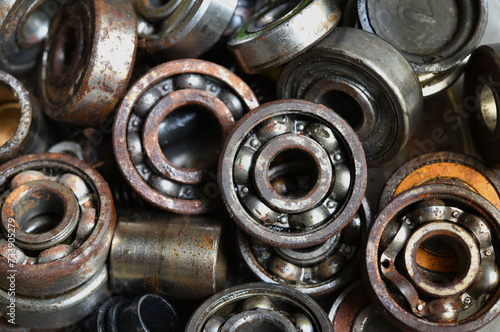 old and rusty ball bearing with grease stain.
