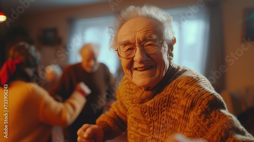 Elderly Joy at a Gathering, senior woman smiles warmly, surrounded by friends at a festive indoor event, encapsulating the joy and community spirit among the elderly photo