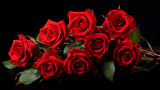 a bunch of red roses on a black background