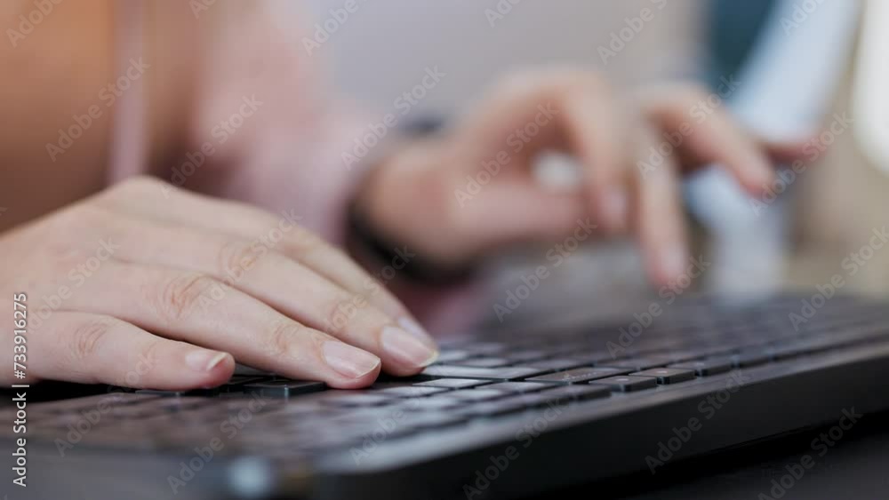 close up with hands of a woman working on the computer in front of the monitor. close up with hands of a woman working on the computer in front of the monitor.