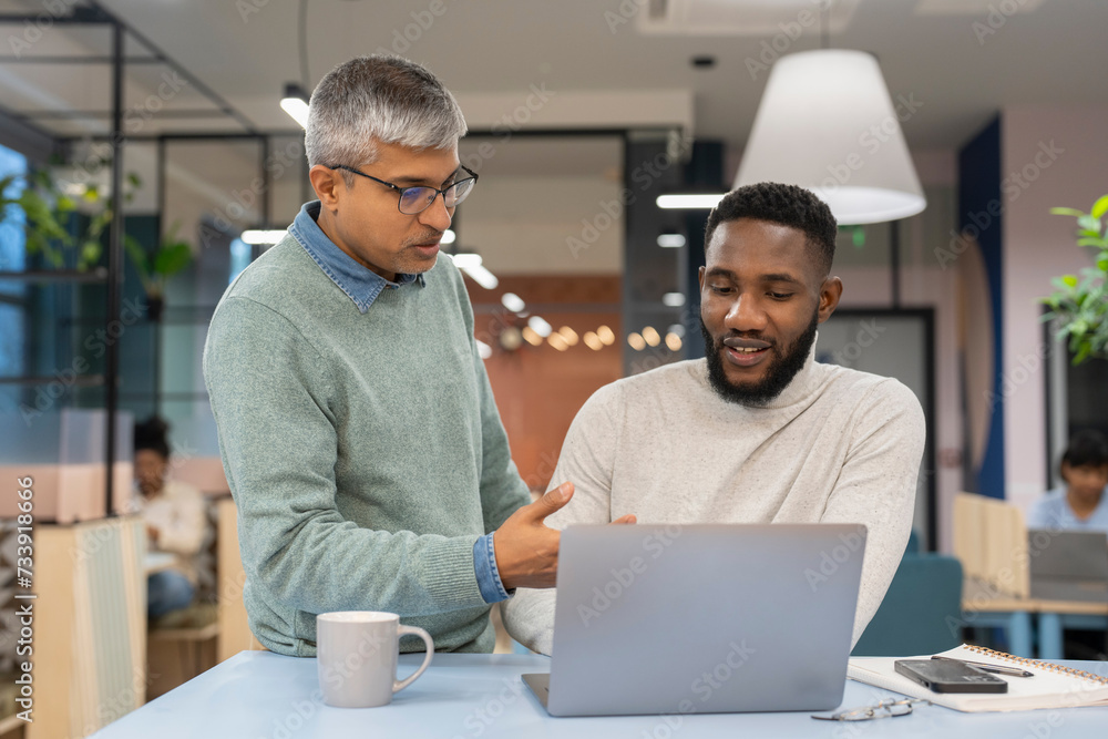 Businessmen working together in modern office Businessmen working together in modern office