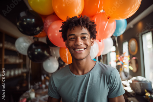 Young African American man in a birthday party © luismolinero