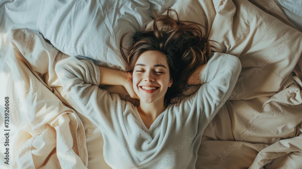 Smiling Young Woman Enjoying Comfortable Morning in Bed. Smiling Young Woman Enjoying Comfortable Morning in Bed.