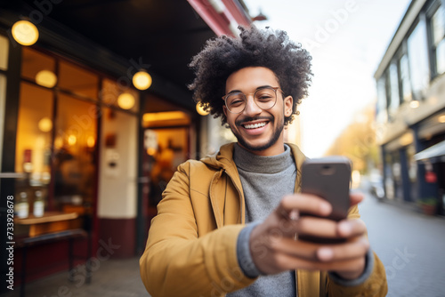 Young African American man using mobile phone