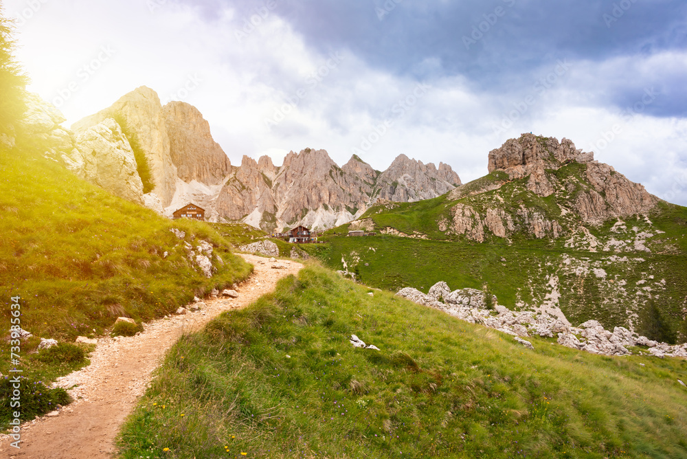 Mountain hiking trail with people walking in Dolomite alps Mountain hiking trail with people walking in Dolomite alps