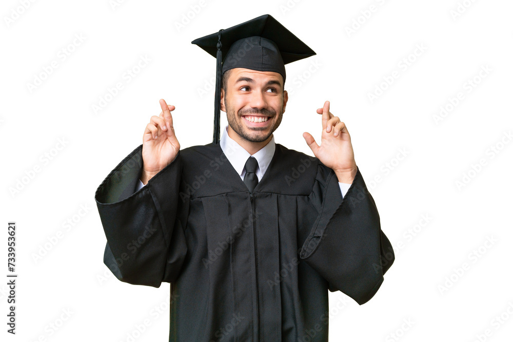 Young university graduate man over isolated background with fingers crossing Young university graduate man over isolated background with fingers crossing