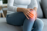 Close-up of a Woman Holding Her Knee in Pain, Highlighting Joint or Muscle Discomfort