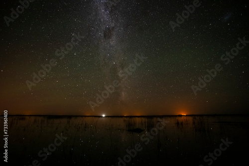 Starry sky reflected in the water, La Pampa Province, Patagonia, Argentina.