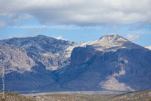 Distant mountains in desert of Arizona with a light dusting of snow.