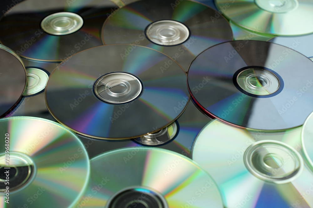 Stacked CD DVD background, close-up. Stacked CD DVD background, close-up.