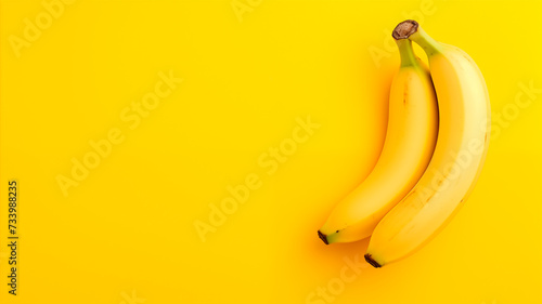 Bananas on a yellow background top view with copy space. Close-up of ripe bananas