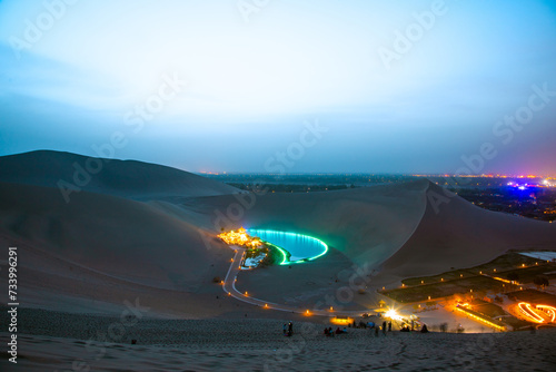 Crescent Moon Spring in Mingsha Mountain  Dunhuang City  Gansu Province - desert night scene