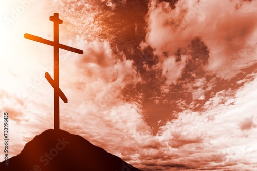 Jesus Christ cross on hill with sky background