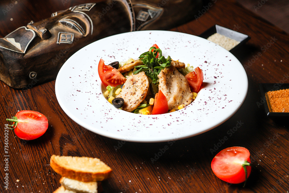 White Plate With Deliciously Topped Meat and Vegetables White Plate With Deliciously Topped Meat and Vegetables