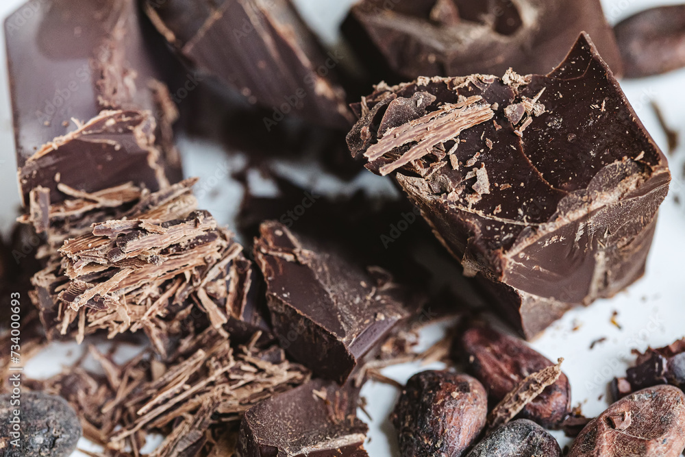 Cocoa beans with chocolate on a white background. Shalllow dof. Cocoa beans with chocolate on a white background. Shalllow dof.