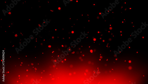 Blurred red fire embers sparks on black background . Texture isolated overlays. Concept of particles, sparkles, flame and light.