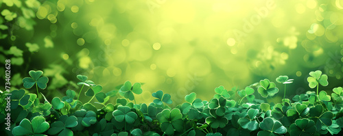 St patricks day banner. Border with lucky clover leaves on green background with copy space. St. Patrick's day concept. Shamrocks Irish holiday symbol. Templates for celebration, ads, greeting card.