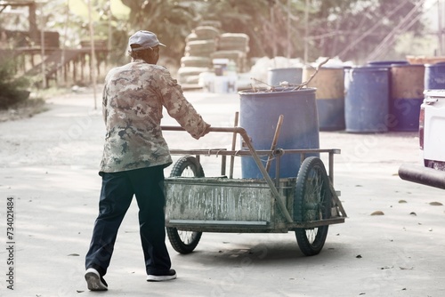 Elderly man working to collect garbage