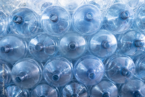 Background of large gallons on empty water bottle