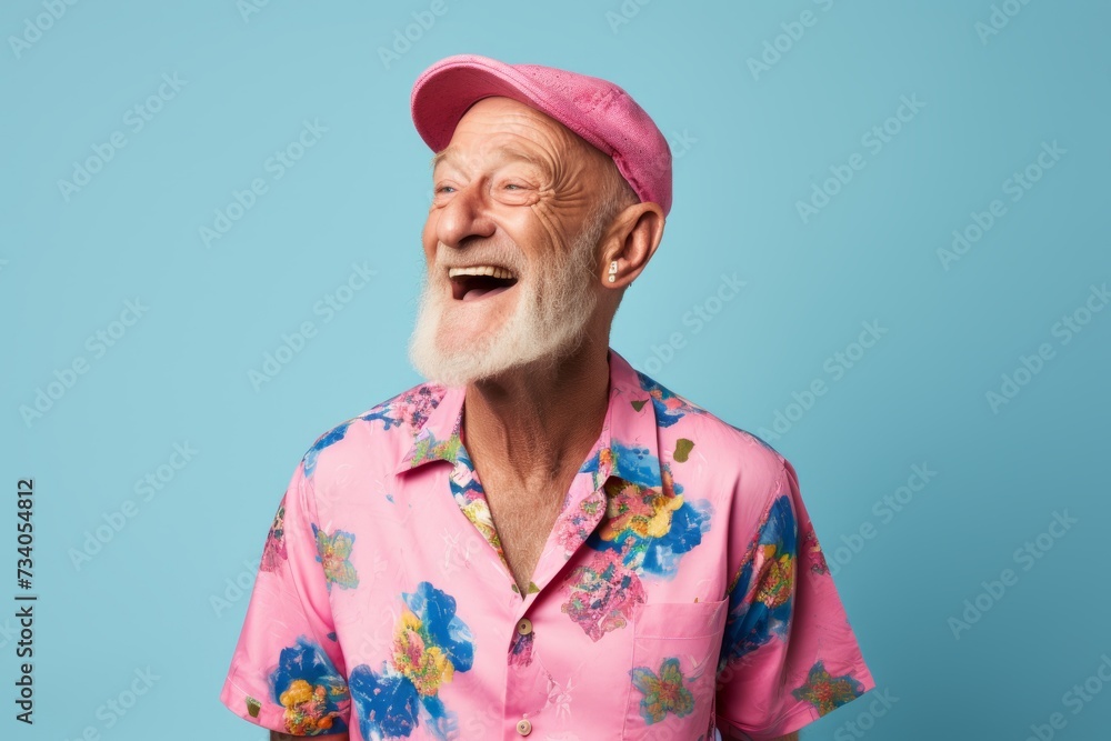 Portrait of happy senior man in summer clothes on blue background. Portrait of happy senior man in summer clothes on blue background.