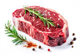 Fresh raw beef rib eye steak with salt, peppercorns and rosemary isolated on white background