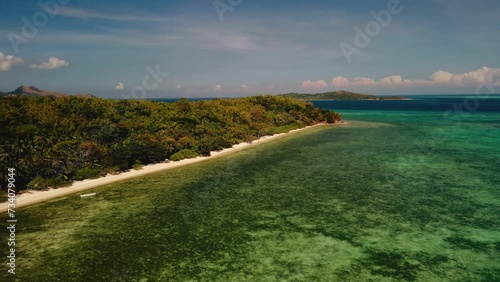 
Aerial 4k view cinematic over Marcilla beach, Coron, The Philippines. Beautiful scenic tropical beaches, mangroves, and turquoise waters photo