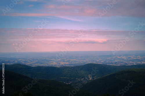 Pink clouds, sunrise over the mountains, view of the village in the mountains © Mariana