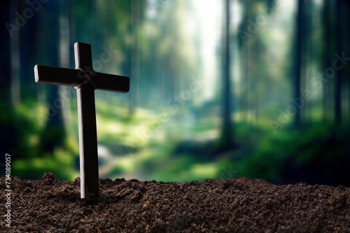 Praying wooden cross in soil outdoor © BillionPhotos.com