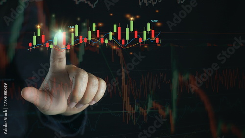 Hand of Businessman or trader is showing a growing virtual hologram stock on smartphone, planning and strategy, Stock market, Business growth, progress or success concept. invest in trading.