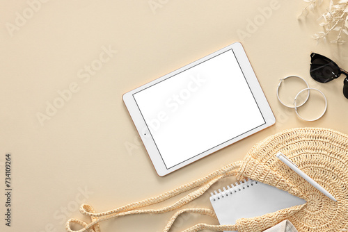 Flat lay composition with modern tablet on beige background. Space for text