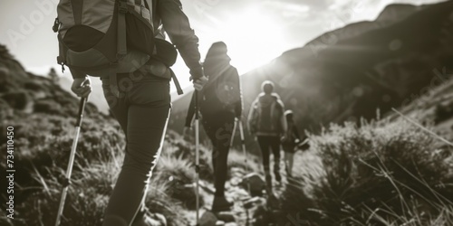 A group of people hiking up a mountain. Suitable for outdoor adventure or travel themes