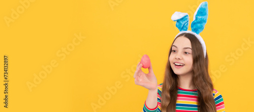 look at that. happy childhood. cheerful bunny kid. happy easter holiday. child hold painted eggs. Easter child horizontal poster. Web banner header of bunny kid, copy space.