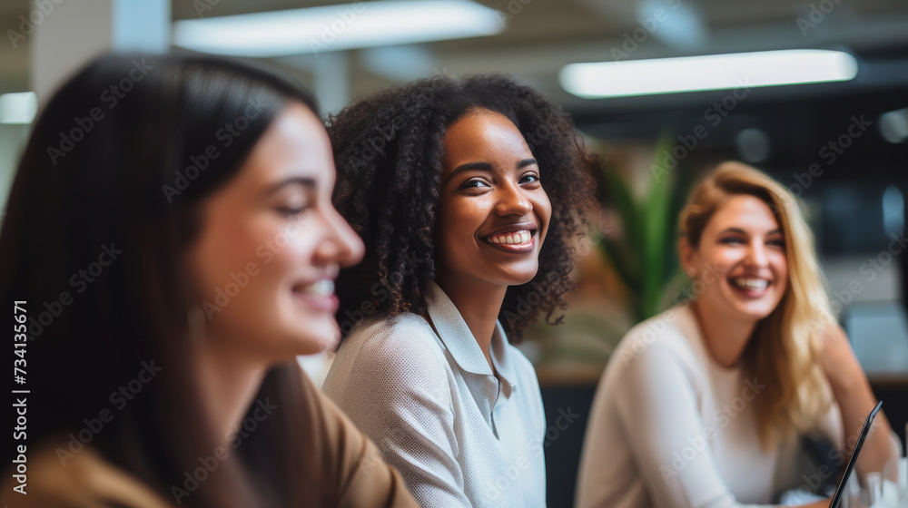 Obraz premium A group of diverse women working together, smiling