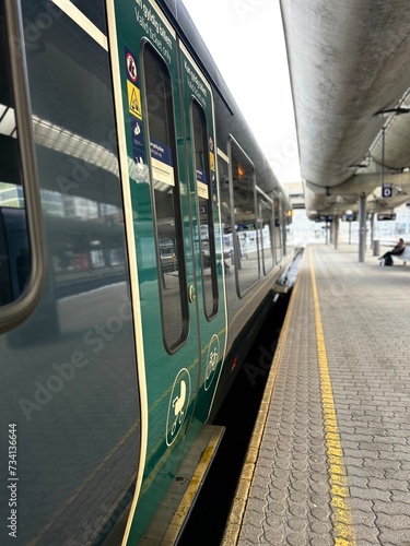 train in motion, olso city, grey and green coulors. photo