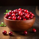 Cranberries in wooden bowl on dark background