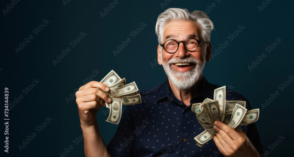 Portrait of a happy senior man holding money over dark background. Portrait of a happy senior man holding money over dark background.