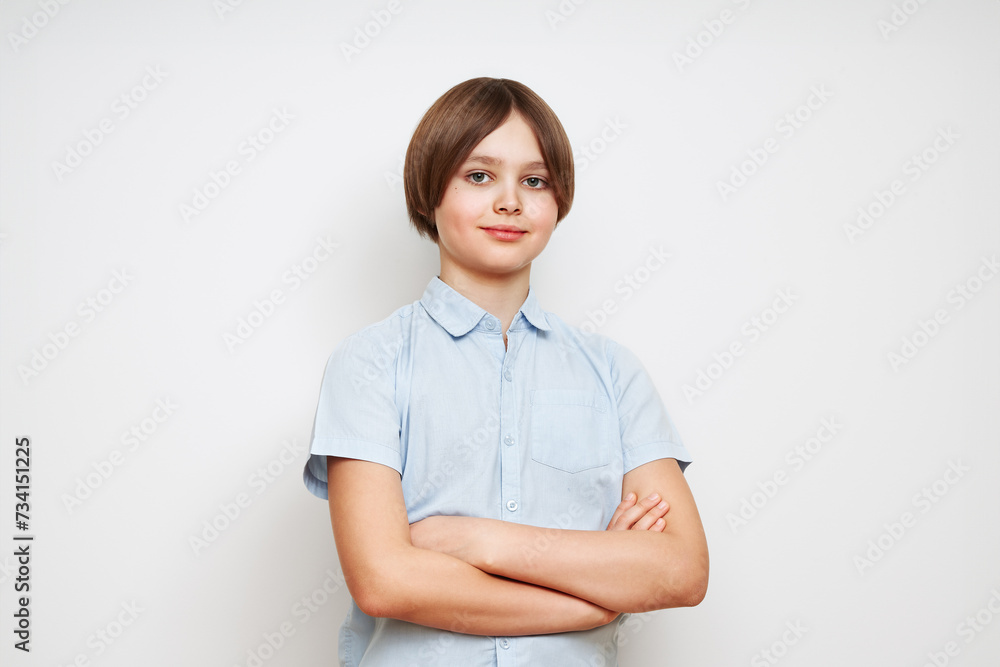 Happy young caucasian boy in casual outfit with arms crossed isolated over white background Happy young caucasian boy in casual outfit with arms crossed isolated over white background