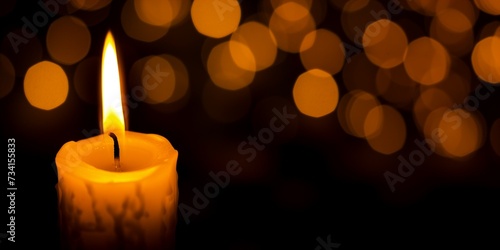 one candle burning in the darkness.