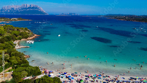 Porto Istana beach - Sassari - Sardinia The bay is a set of four beaches separated by small rocky bands. It is bordered by pink granites and surrounded by the greenery of Mediterranean shrubs.