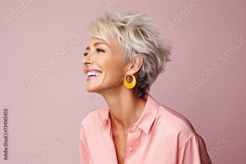 Portrait of a beautiful middle-aged blonde woman with short hair.