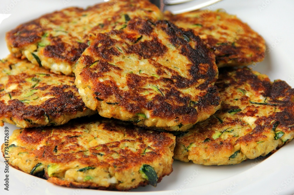 Corn Fritters with Corn. Healthy and Diet Food . Crispy fried corn ball in a white plate on wooden table, Vegetarian food, Thai food, snacks Thai style. Zucchini fritters or vegetarian zucchini pancak Corn Fritters with Corn. Healthy and Diet Food . Crispy fried corn ball in a white plate on wooden table, Vegetarian food, Thai food, snacks Thai style. Zucchini fritters or vegetarian zucchini pancak