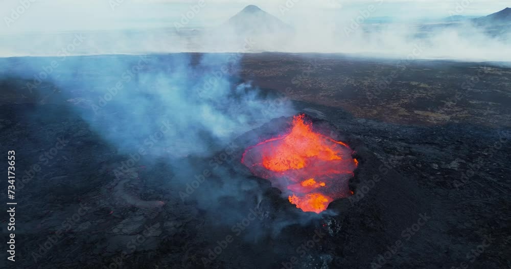Aerial drone footage of active volcano eruption in Iceland. Hot lava